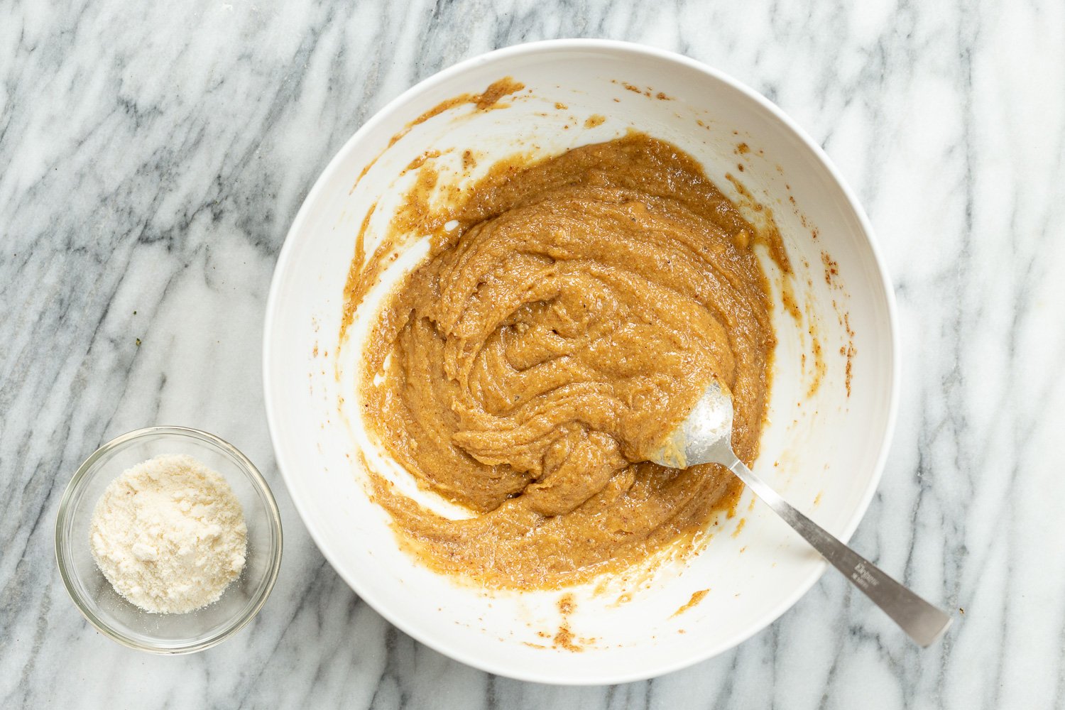 Dough for our Tahini Cookies in a white bowl