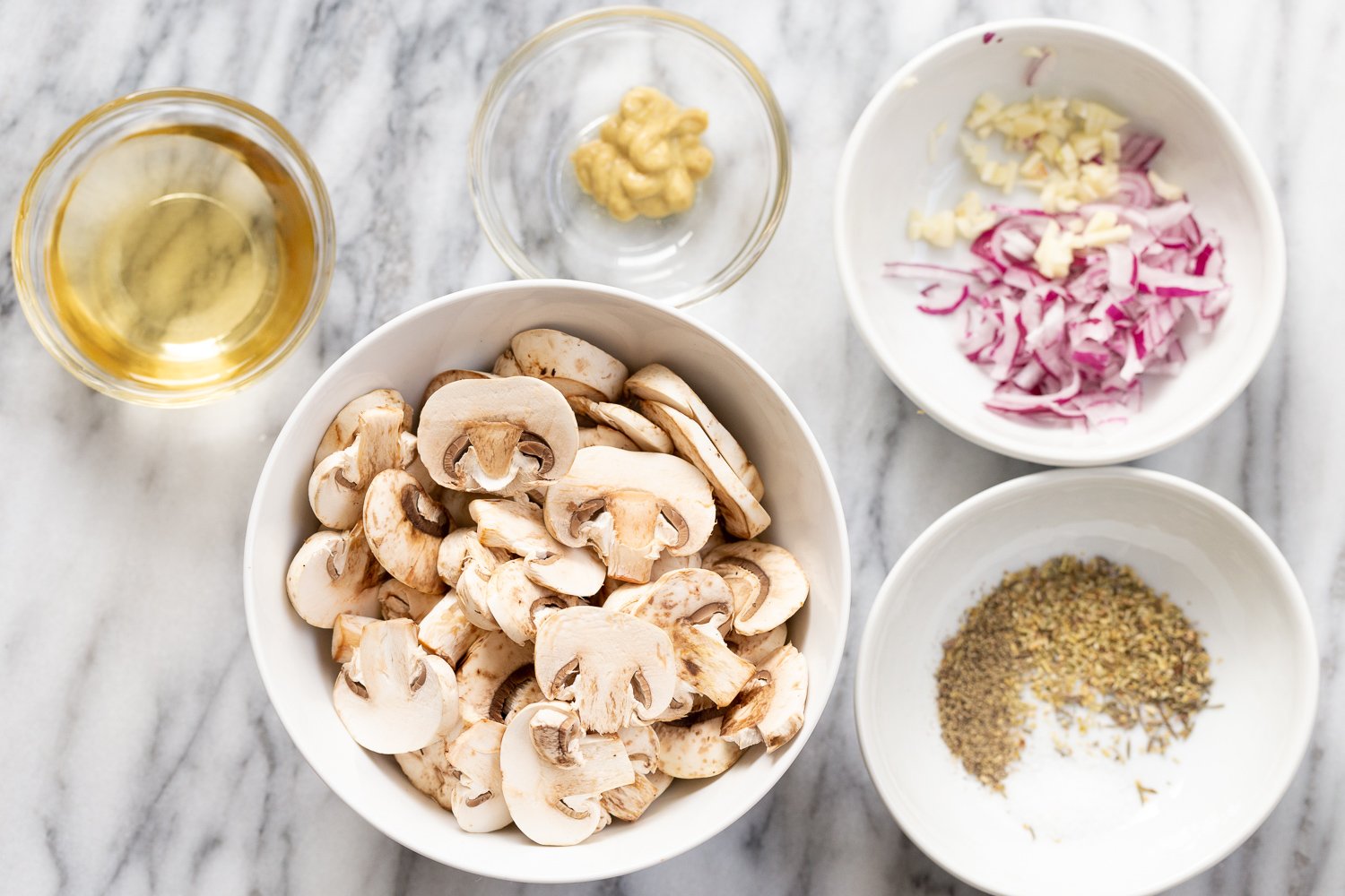 Ingredients for our Vegan Mushroom Sauce in white bowls