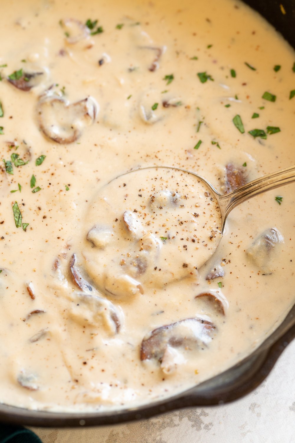 Creamy Vegan Mushroom Sauce in a black skillet