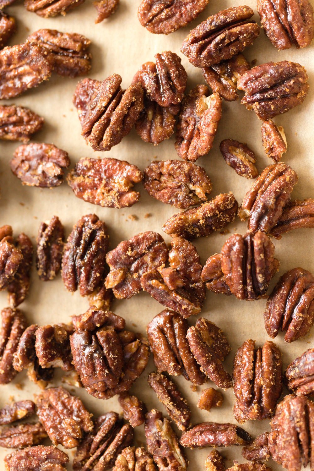 Vegan Candied Pecans on parchment lined sheet