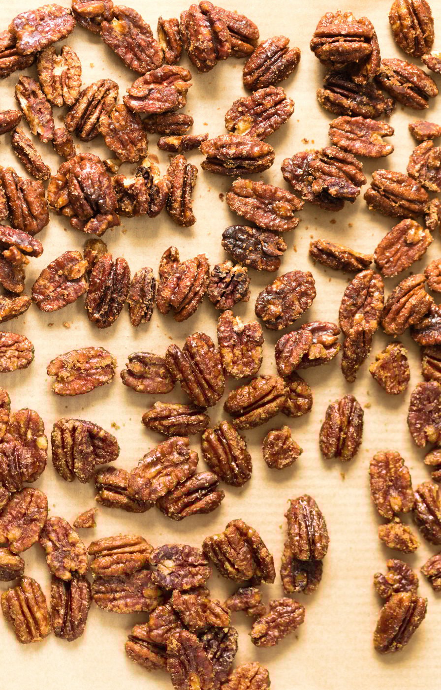 Vegan Candied Pecans on parchment lined sheet