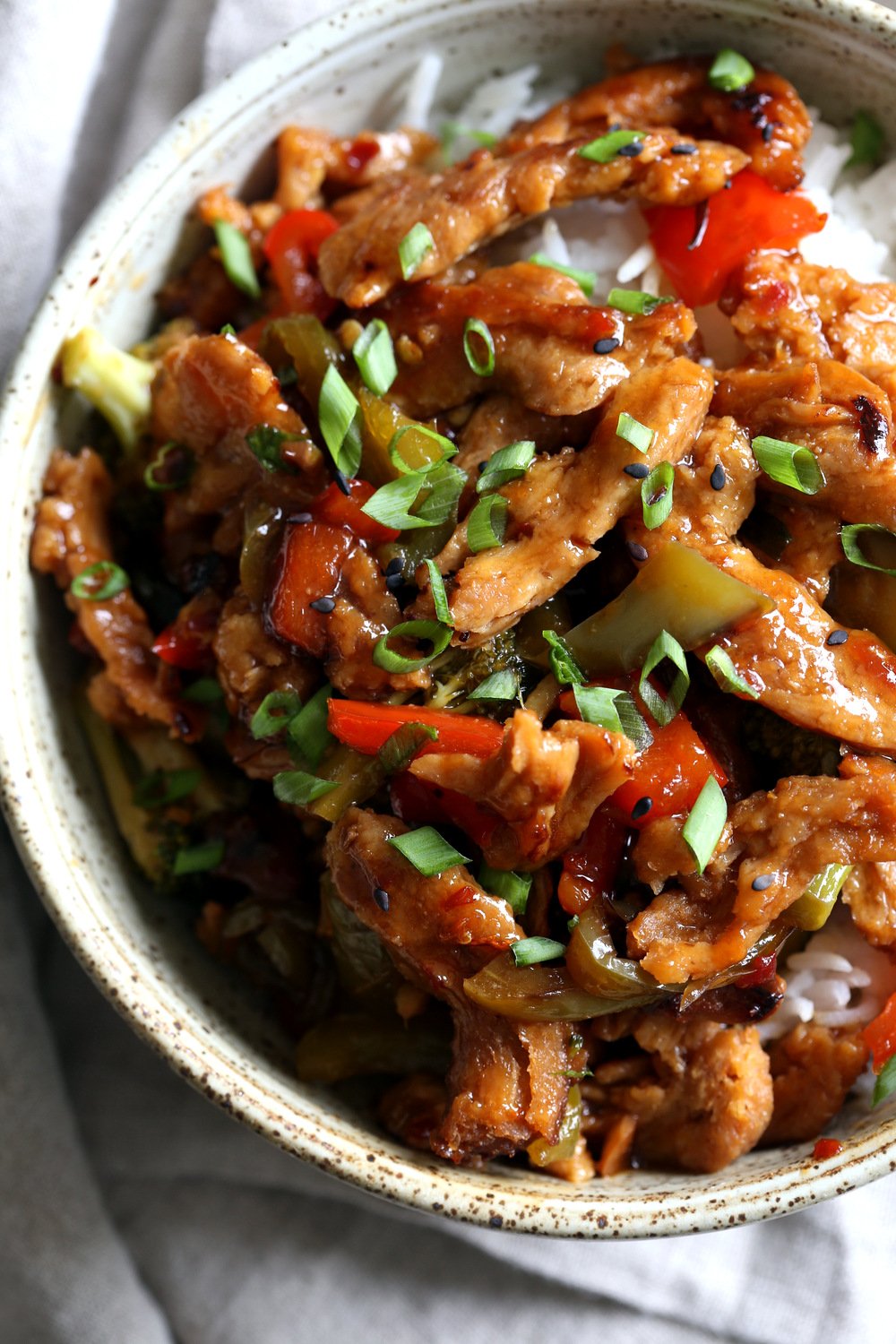 Vegan General Tso Soy curls in a speckled bowl