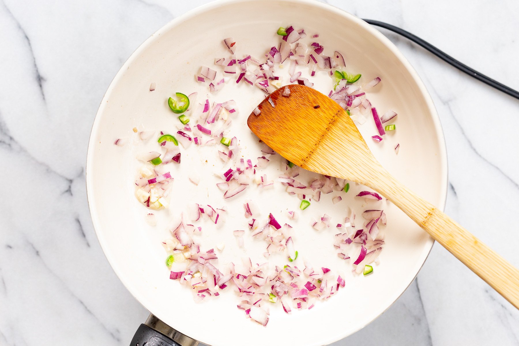Onions on a white skillet