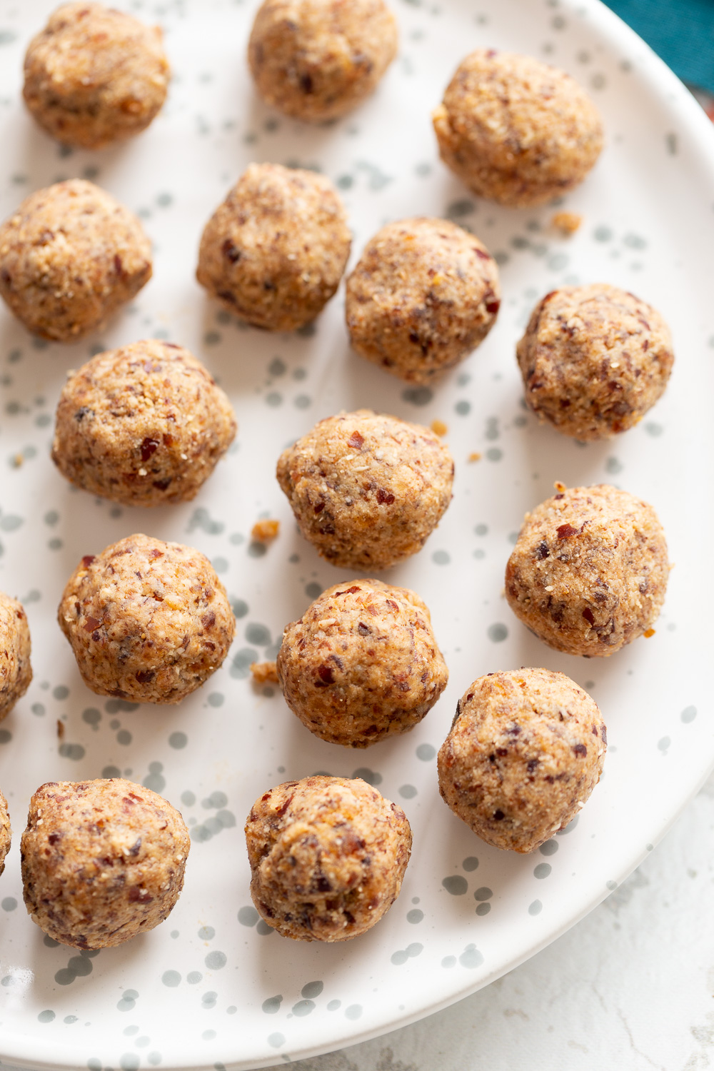 coconut balls  overhead shot of a plate of vegan coconut balls