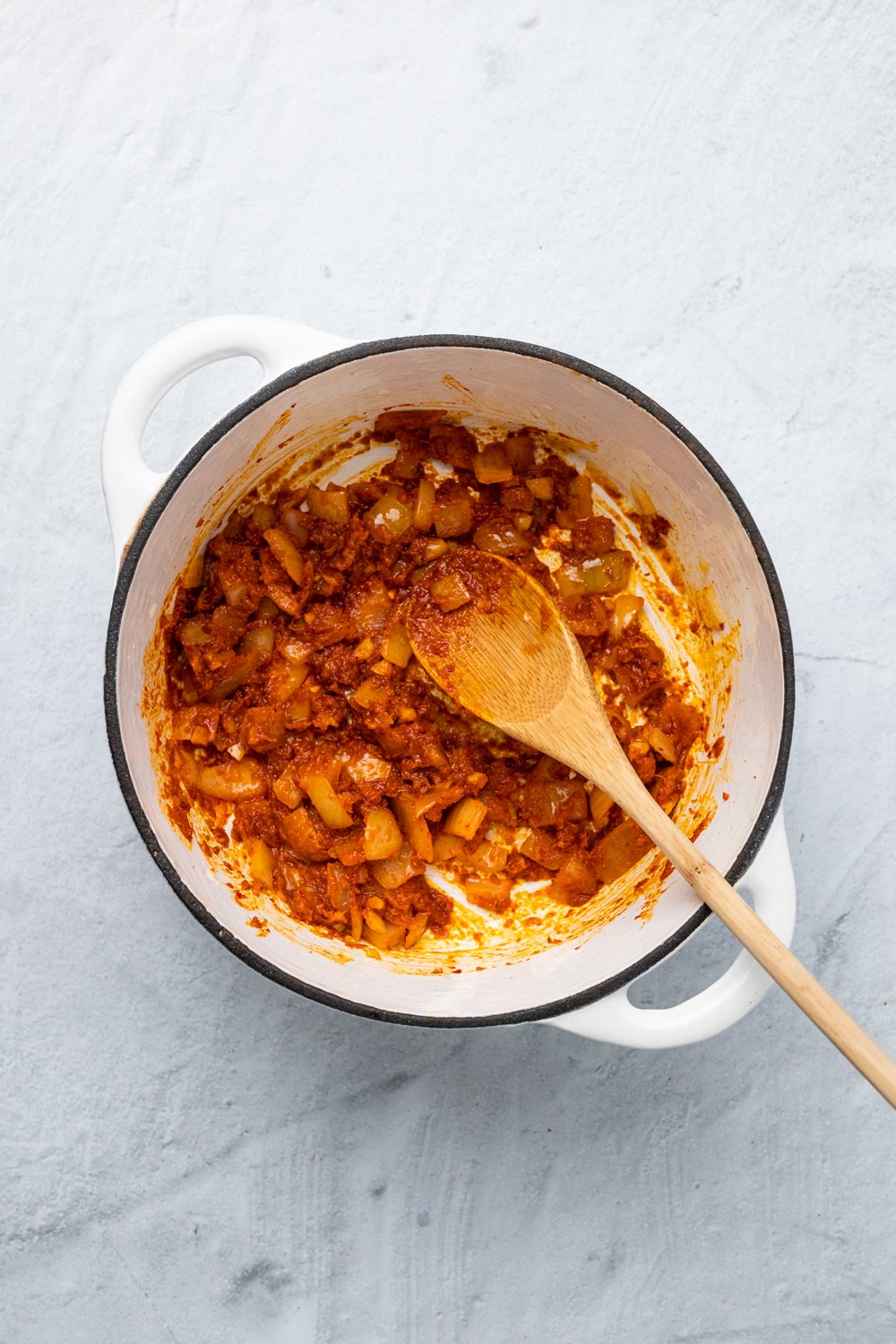 sweet potato curry  onions being sauteed with red curry paste
