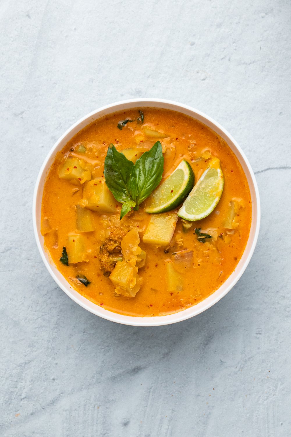 sweet potato curry  overhead shot of a creamy vegan red lentil sweet potato curry