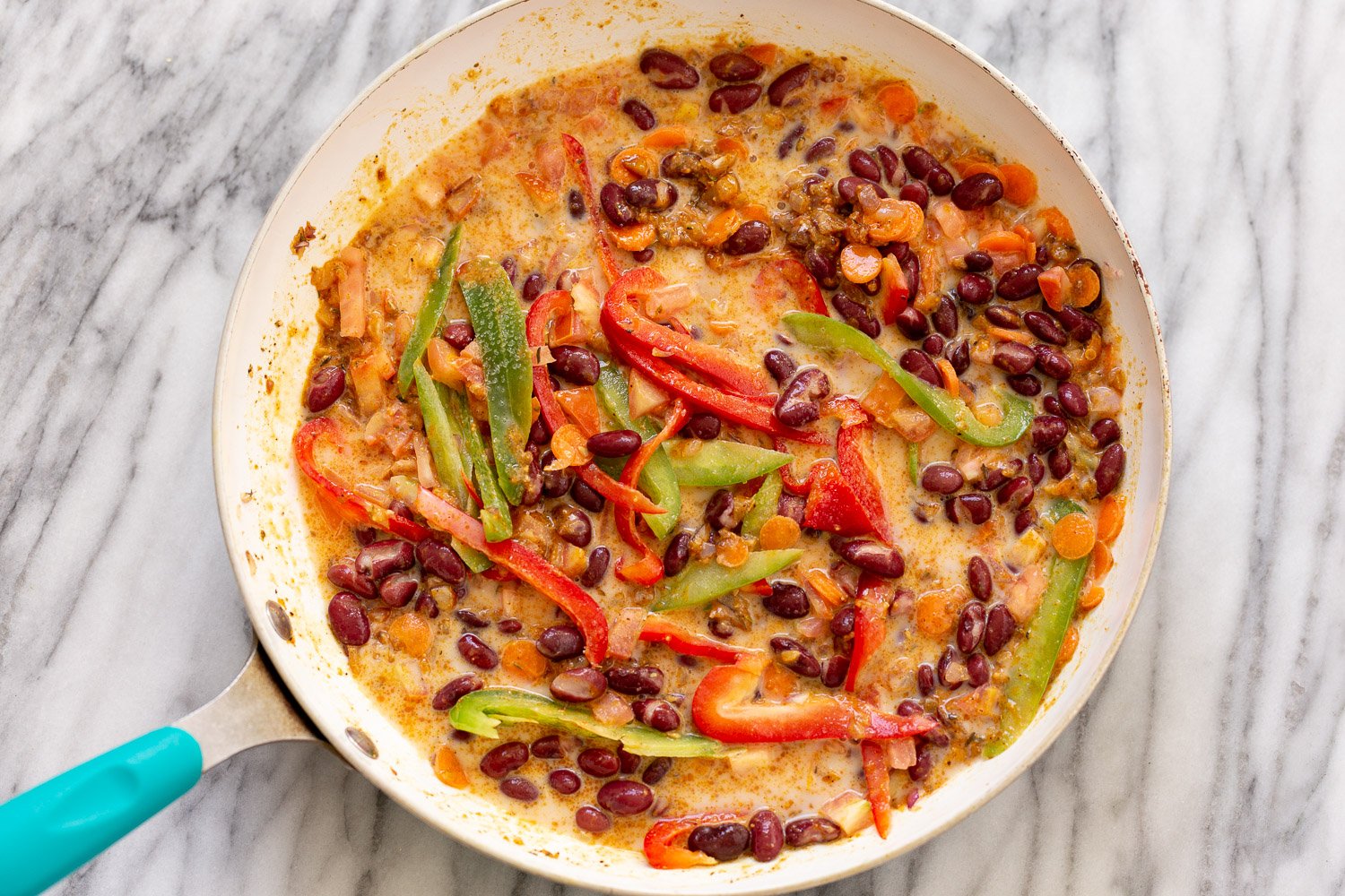 Peanut Stew overhead shot of cooked Vegan Peanut Stew with veggies and peanut butter sauce in a pan
