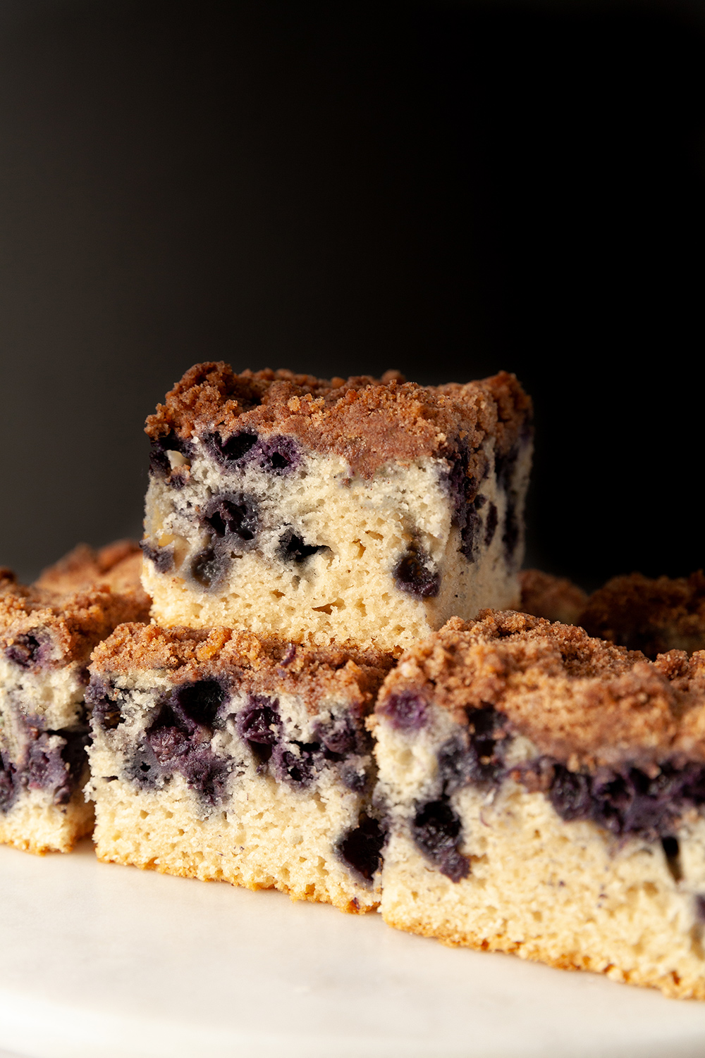 eggless cake  eggless lemon blueberry sheet cake against a black background