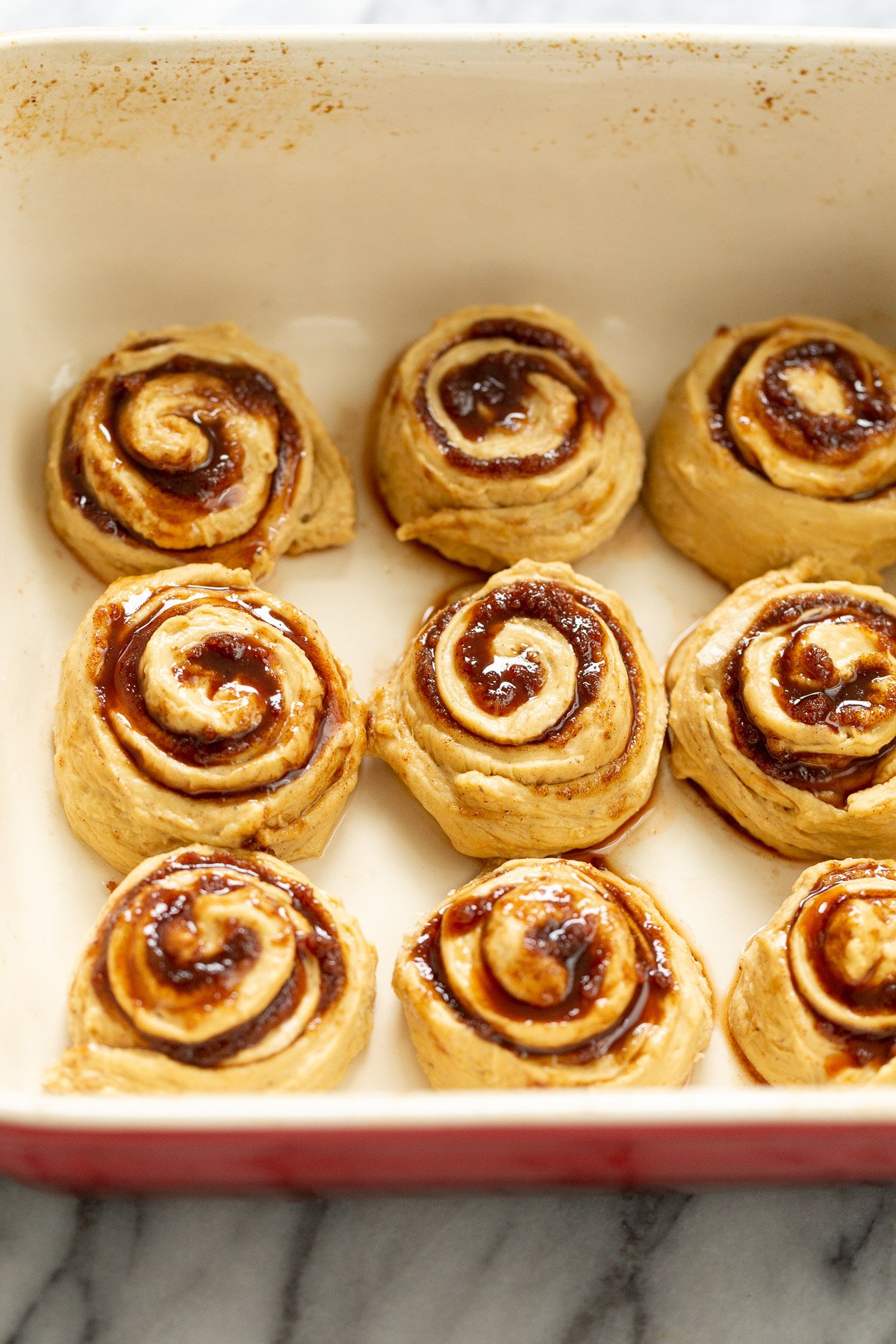 no yeast cinnamon rolls  no yeast sweet potato cinnamon rolls in casserole dish ready to be baked