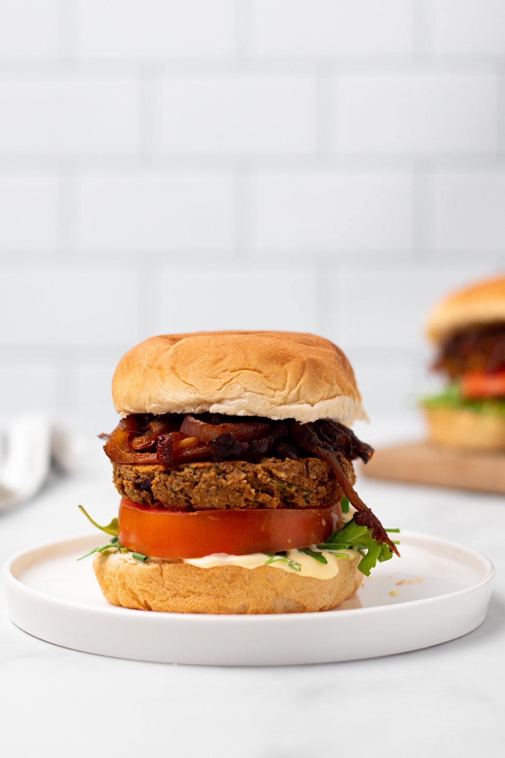 chickpea burger a vegan za'atar spiced chickpea burger on a white plate
