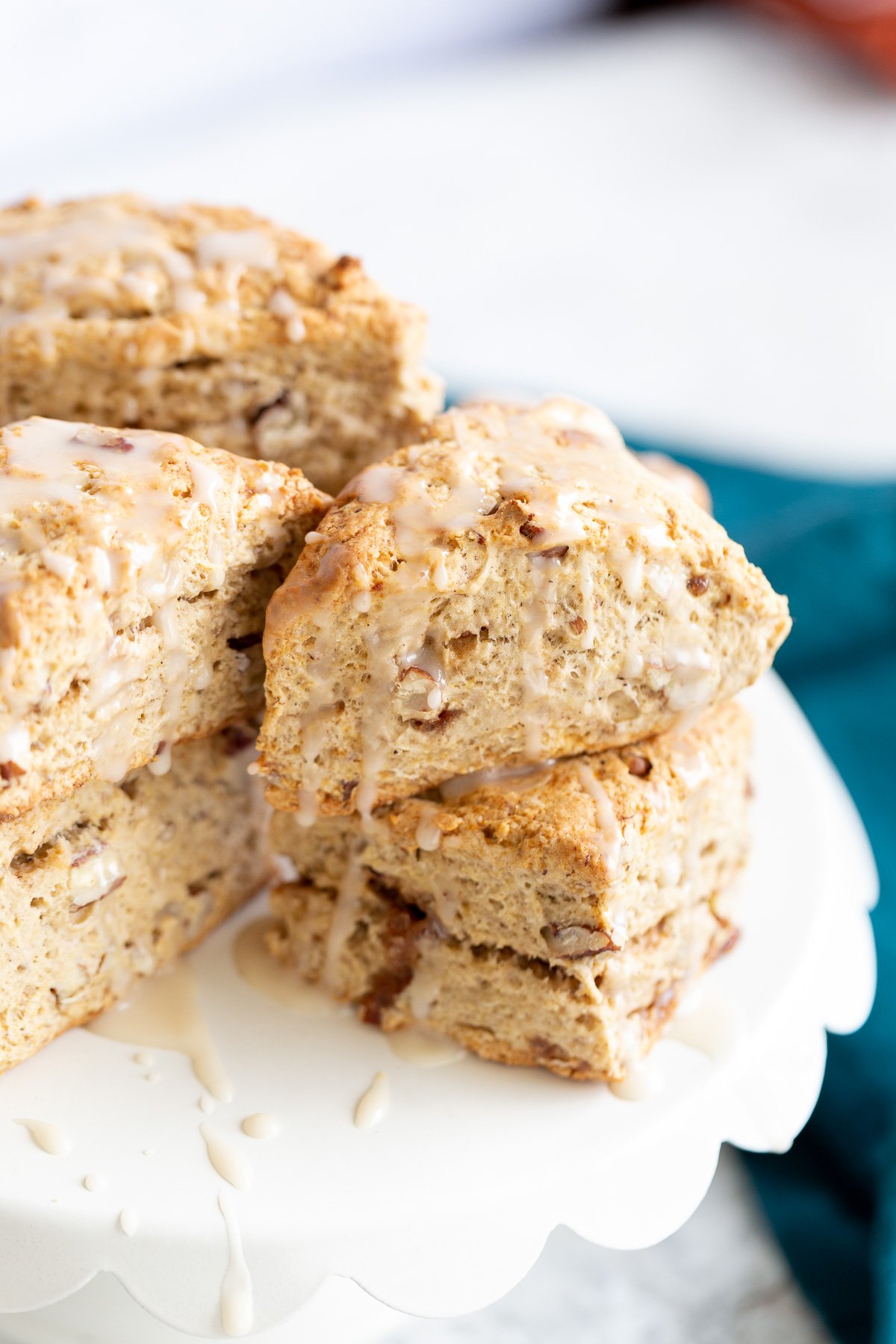 banana scones side view of vegan banana scones on a white cake stand