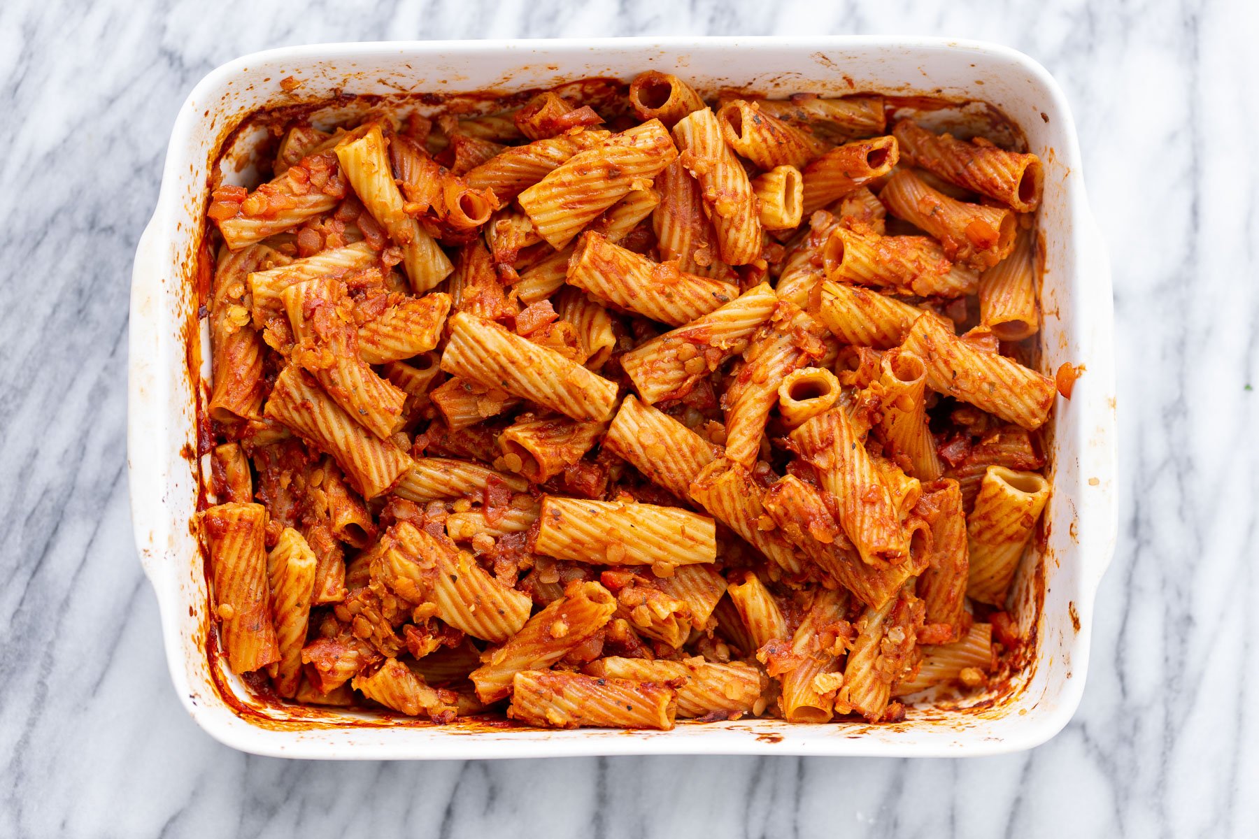 baked rigatoni overhead shot of vegan baked rigatoni before vegan tofu cheese sauce is added