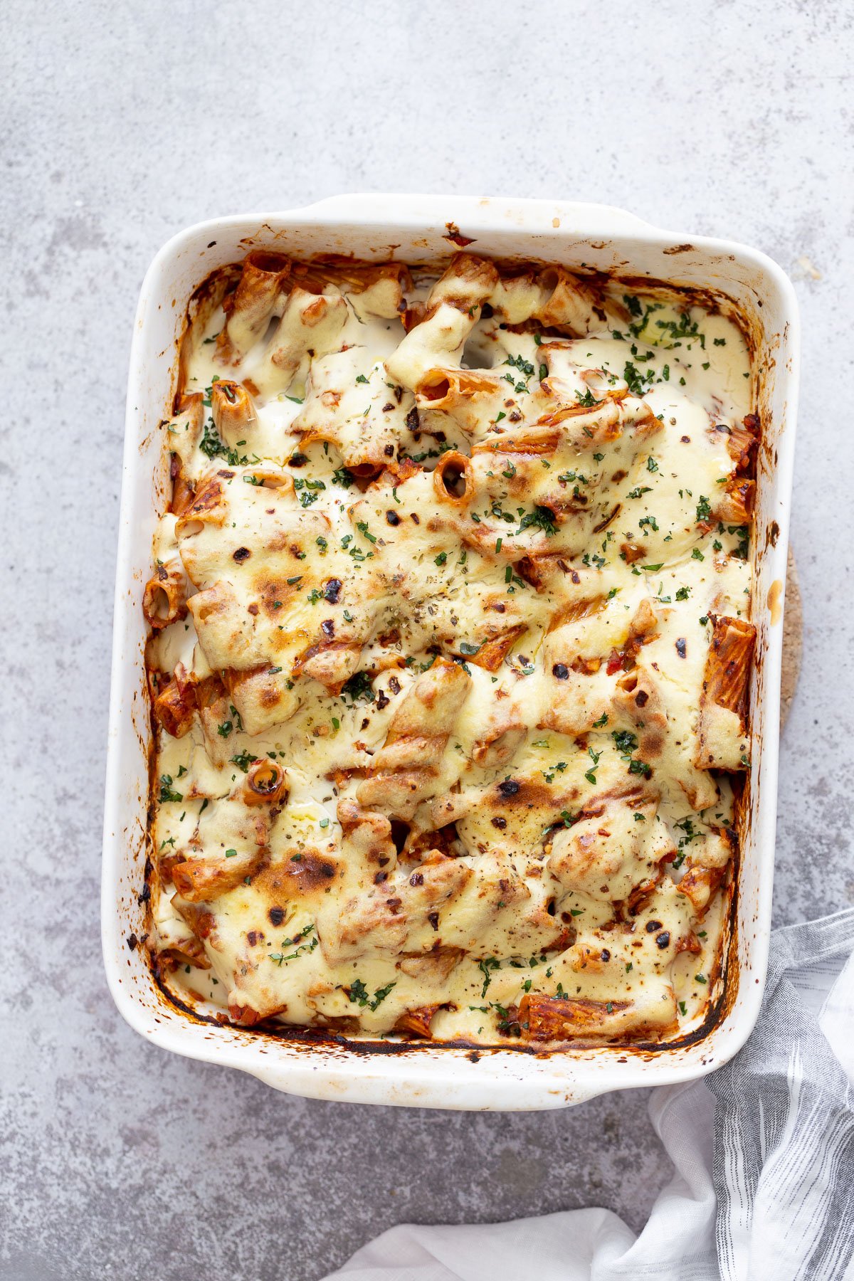 baked rigatoni overhead shot of a casserole dish with vegan baked rigatoni with tofu mozzarella