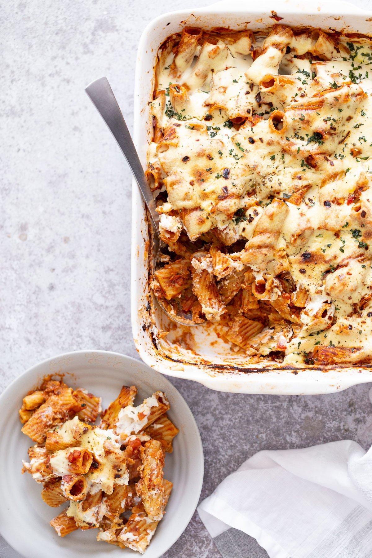baked rigatoni  overhead shot of a white casserole dish with vegan baked rigatoni