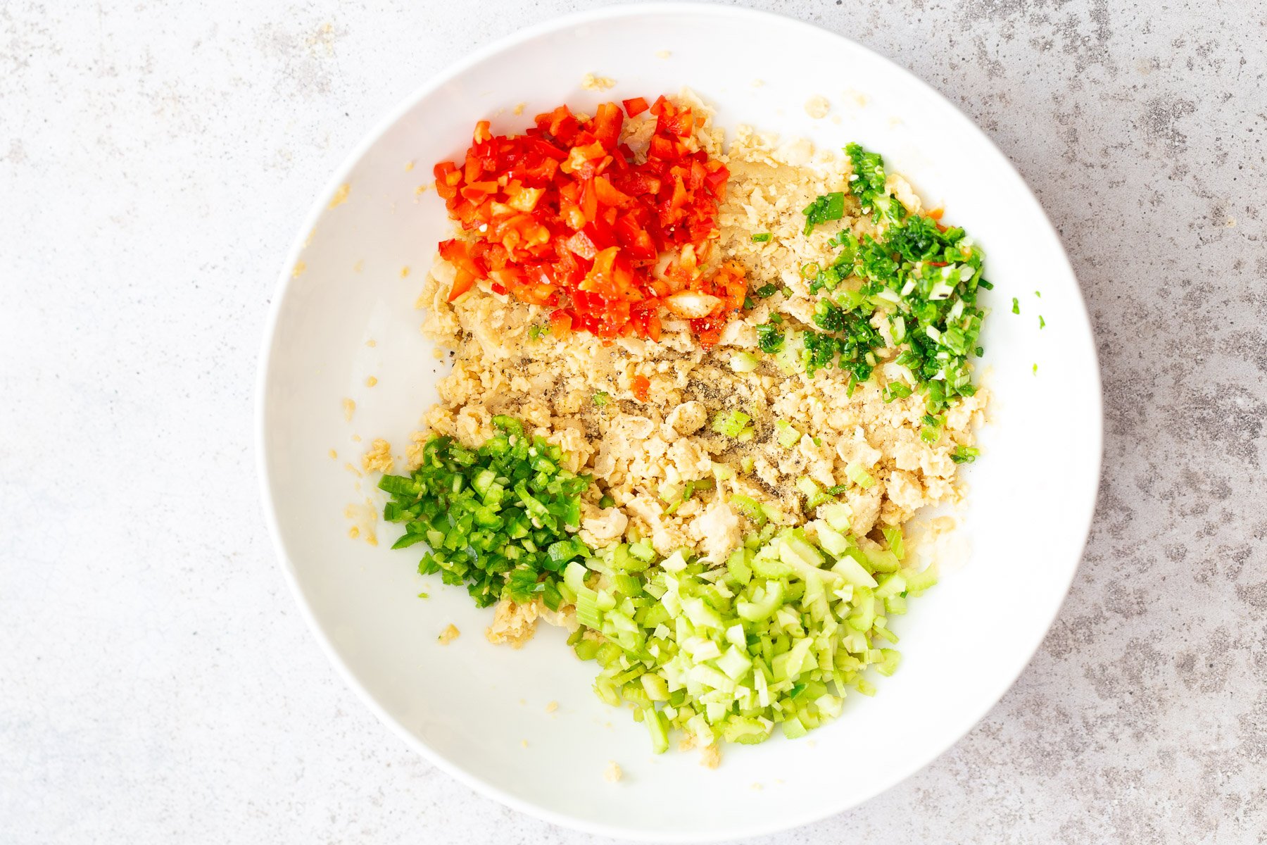 chickpea salad sandwich  vegan chickpea salad ingredients assembled in a white bowl