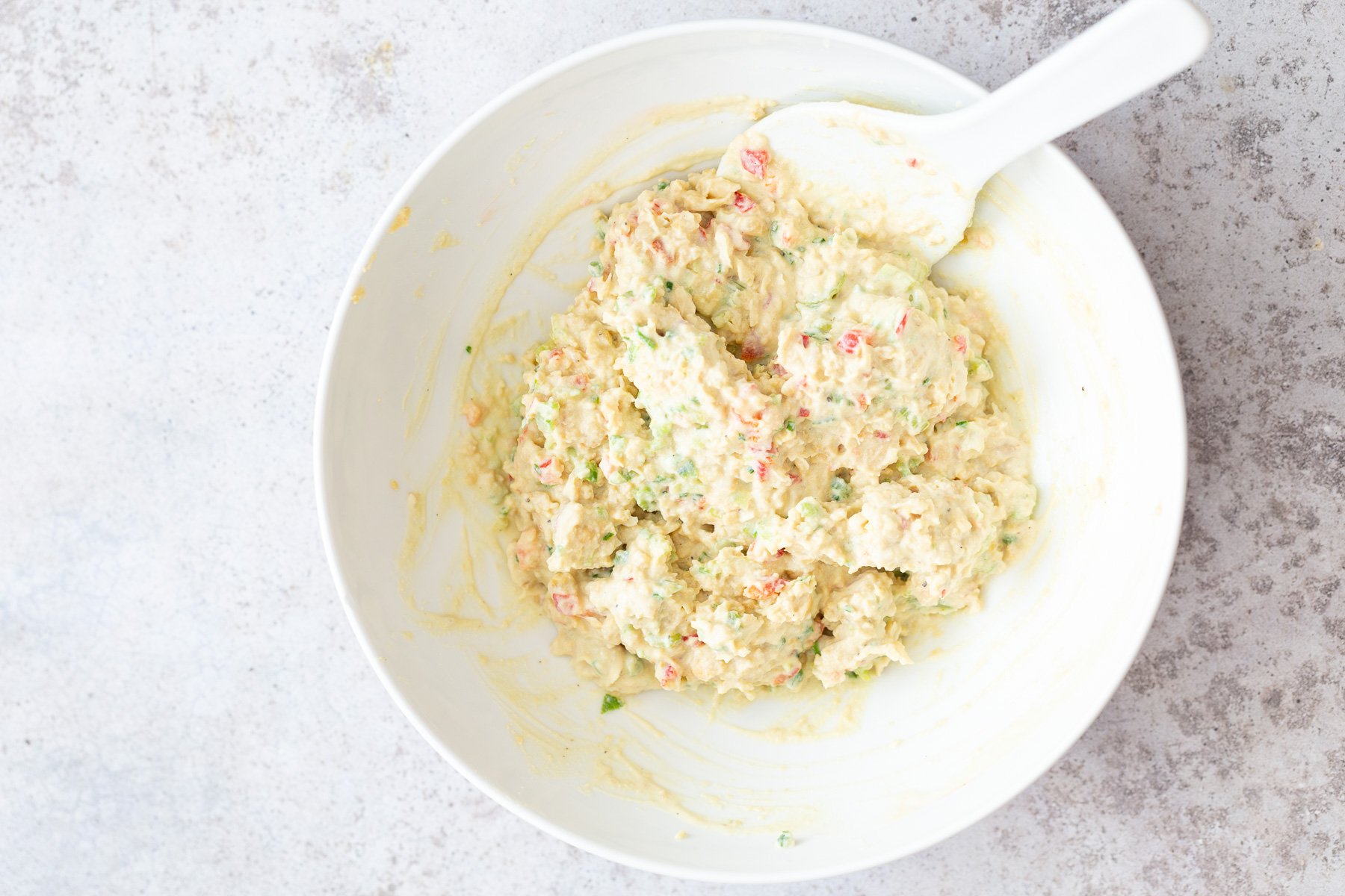 chickpea salad sandwich  creamy vegan jalapeño chickpea salad in a white bowl