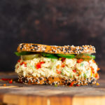 jalapeño popper chickpea salad sandwich on a chopping board