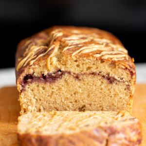 a sliced peanut butter and jelly cake on a cutting board