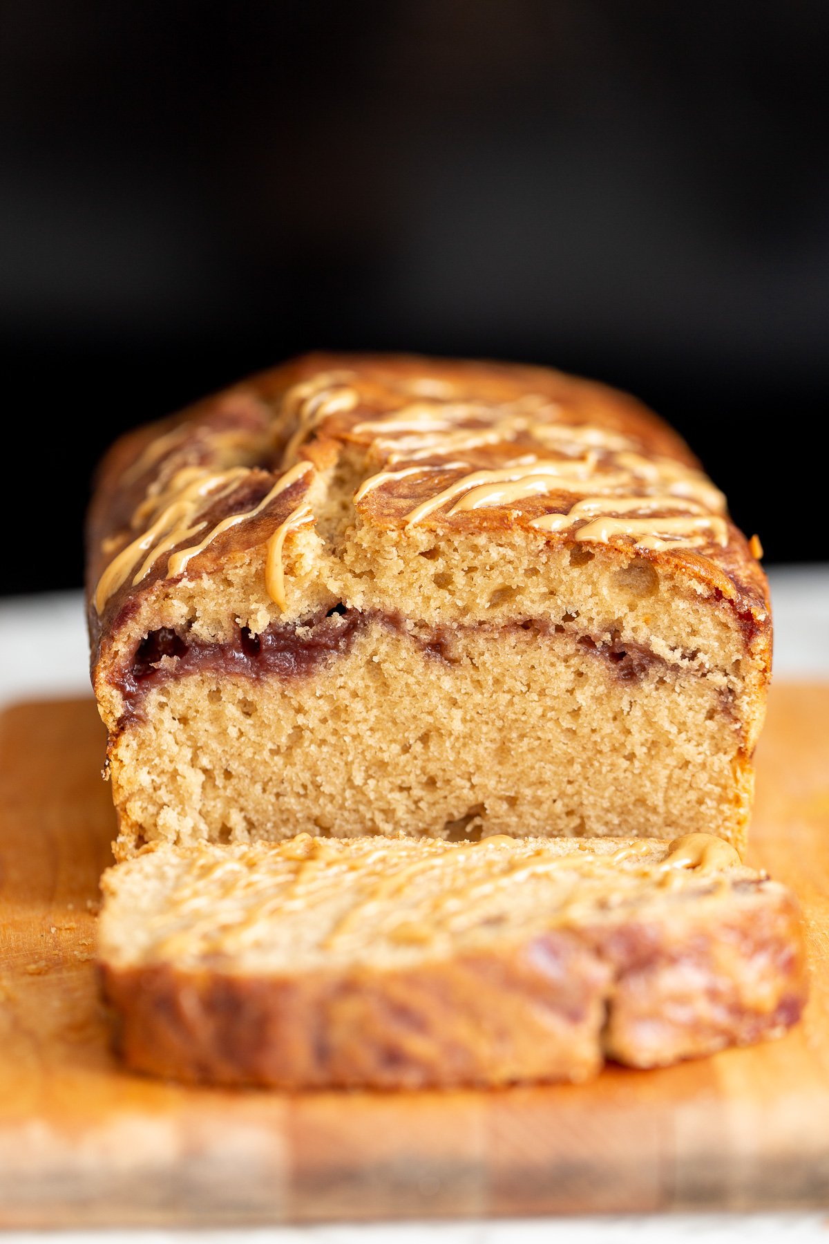 peanut butter and jelly cake  a sliced vegan peanut butter and jelly cake baked in a loaf pan