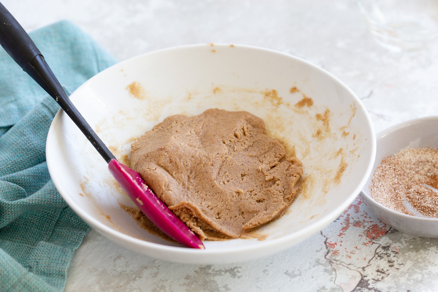 Snickerdoodle bites  batter for rolling vegan Snickerdoodle bites in a white bowl