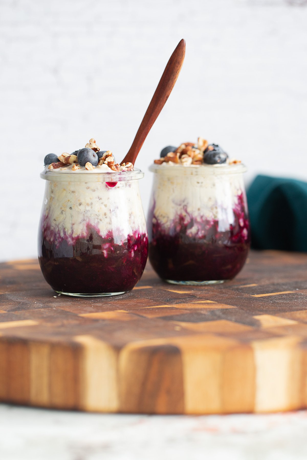 blueberry overnight oats  blueberry muffin overnight oats topped with blueberries and chopped pecans