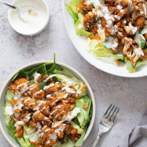 bbq roasted cauliflower salad bowl drizzled with Vegan Ranch Dressing