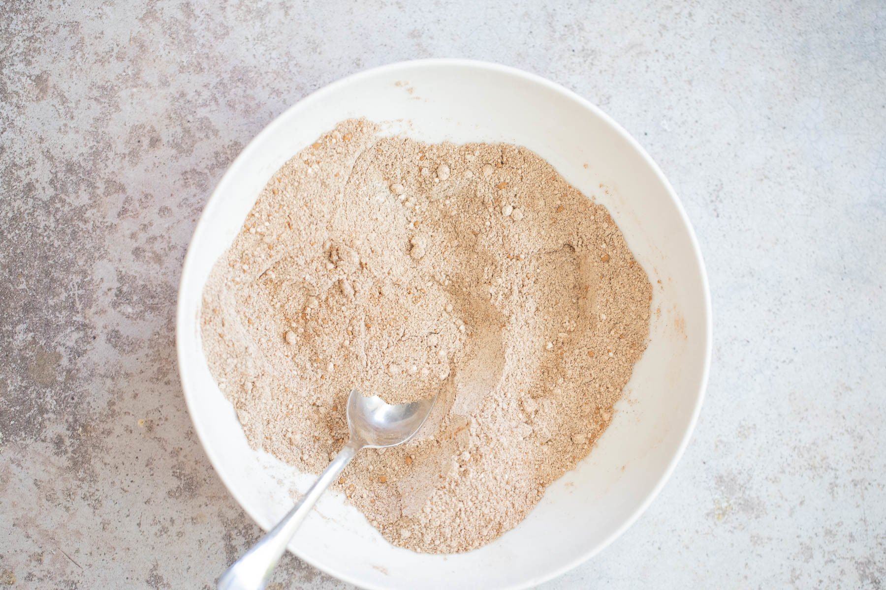 buckwheat waffles  dry ingredients for glutenfree buckwheat waffles in a white bowl