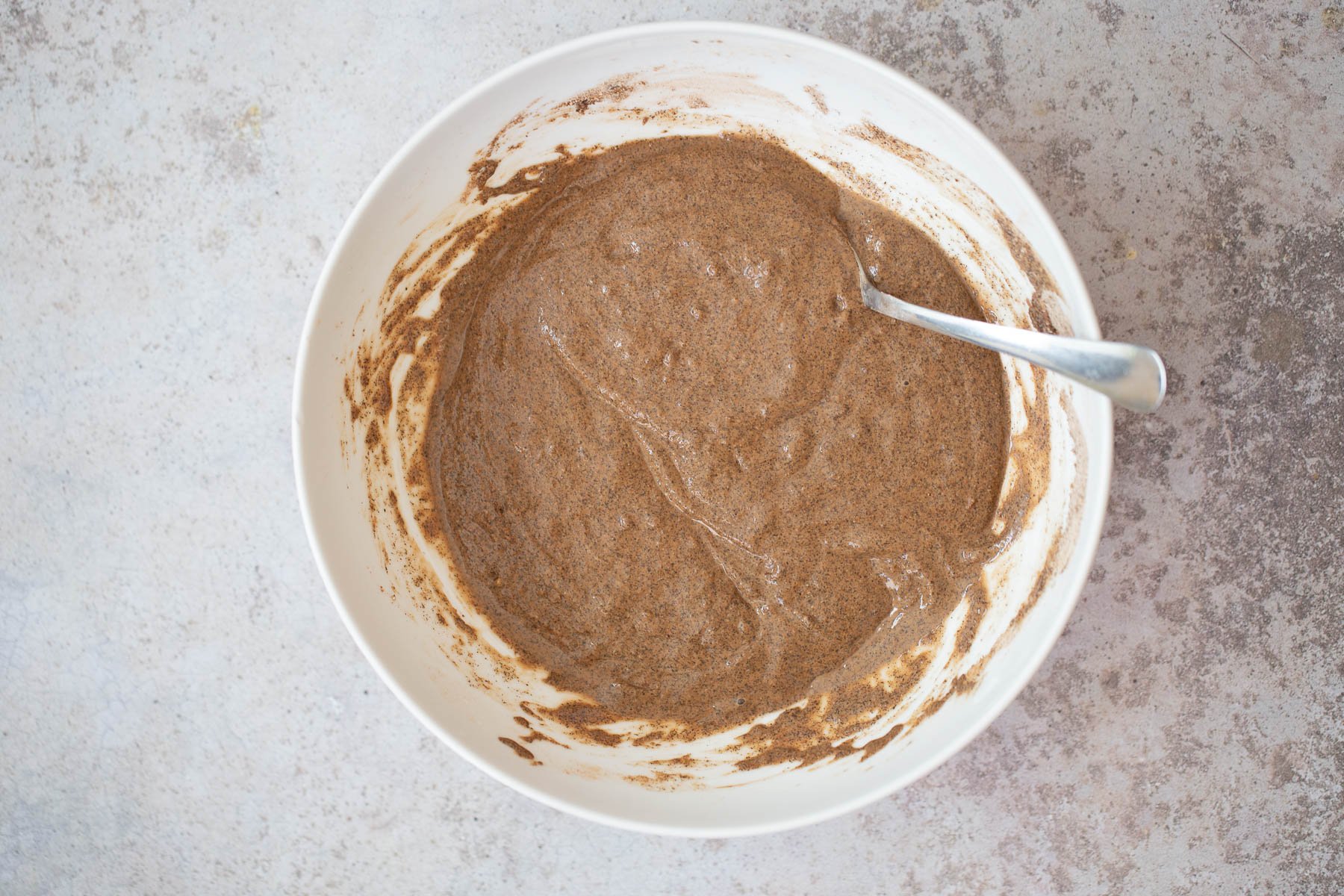 buckwheat waffles  chocolate waffle batter in a white bowl
