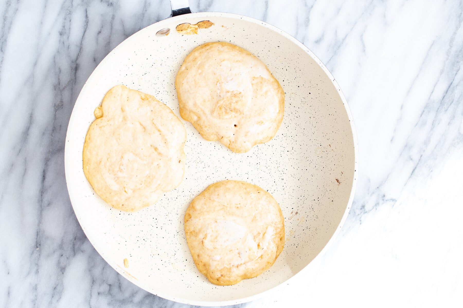 pumpkin pancakes in a frying pan