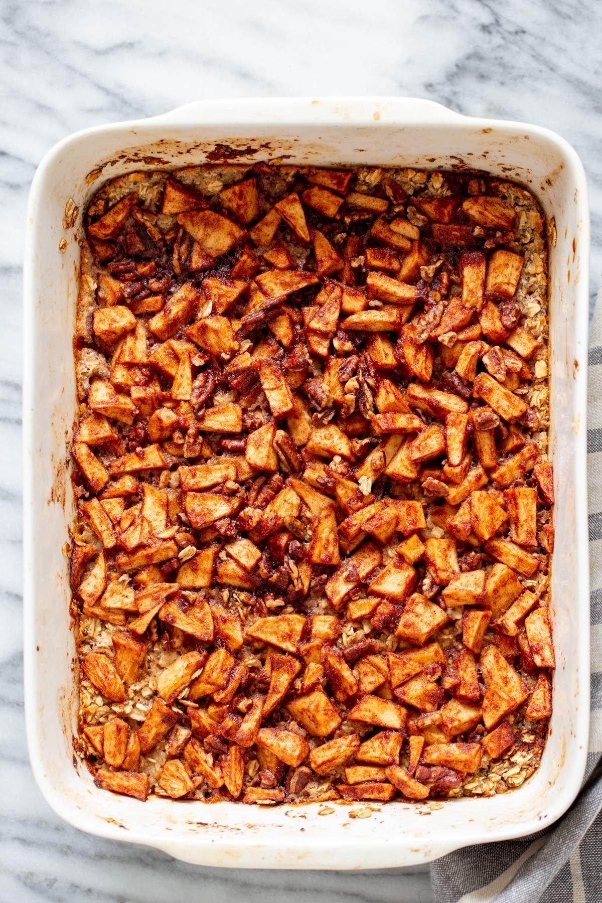 apple pie baked oatmeal overhead shot of a casserole dish with apple pie baked oatmeal