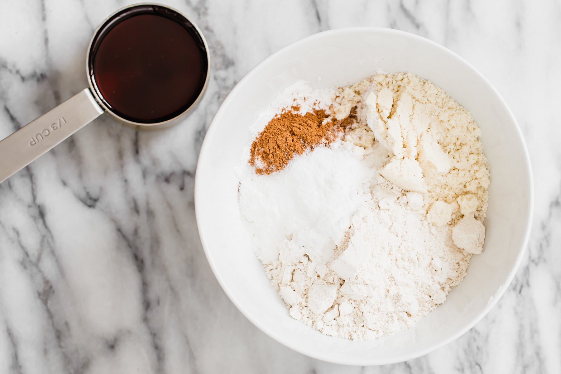 vegan snickerdoodles dry ingredients for pumpkin spice snickerdoodles being mixed in a bowl