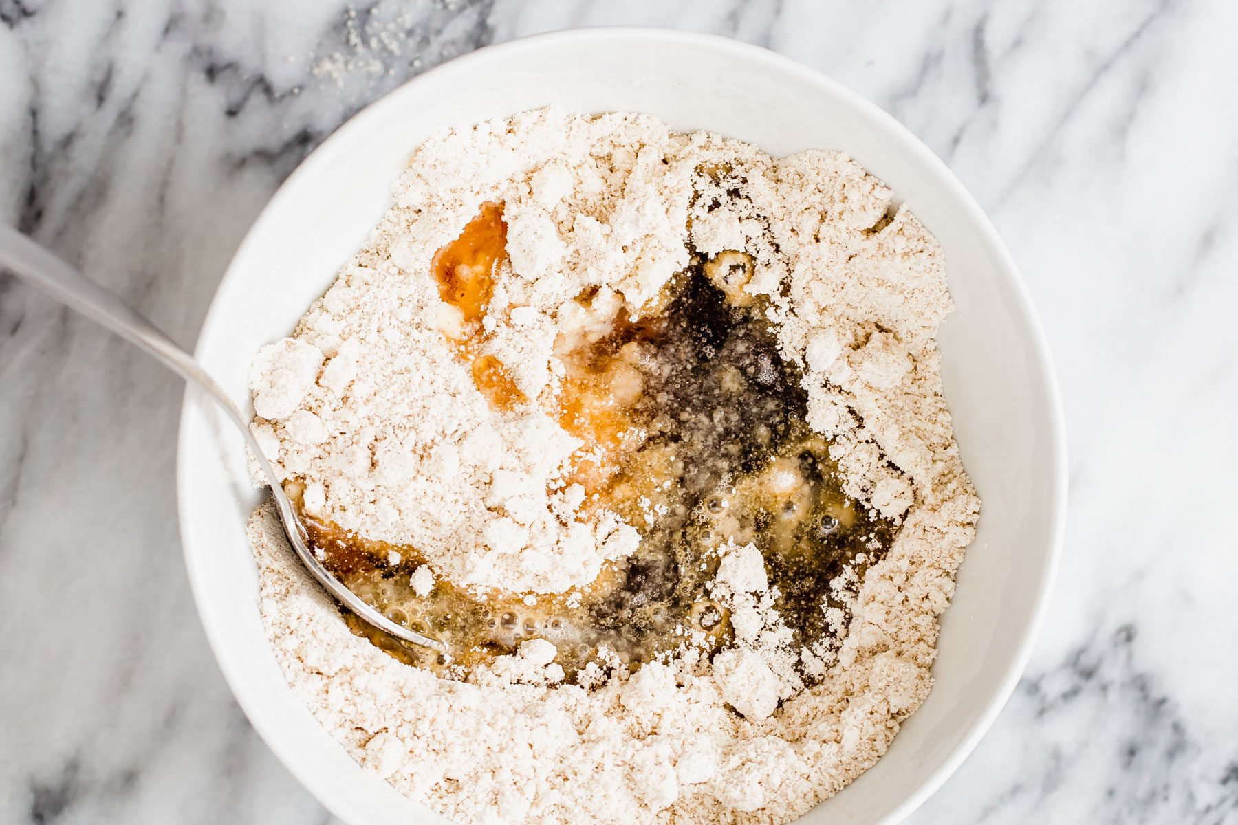 vegan snickerdoodles vegan snickerdoodle cookie batter being mixed in a white bowl