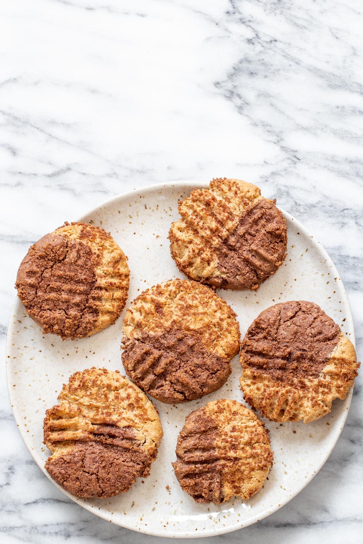 pumpkin spice snickerdoodles a plate with vegan pumpkin spice snickerdoodle cookies