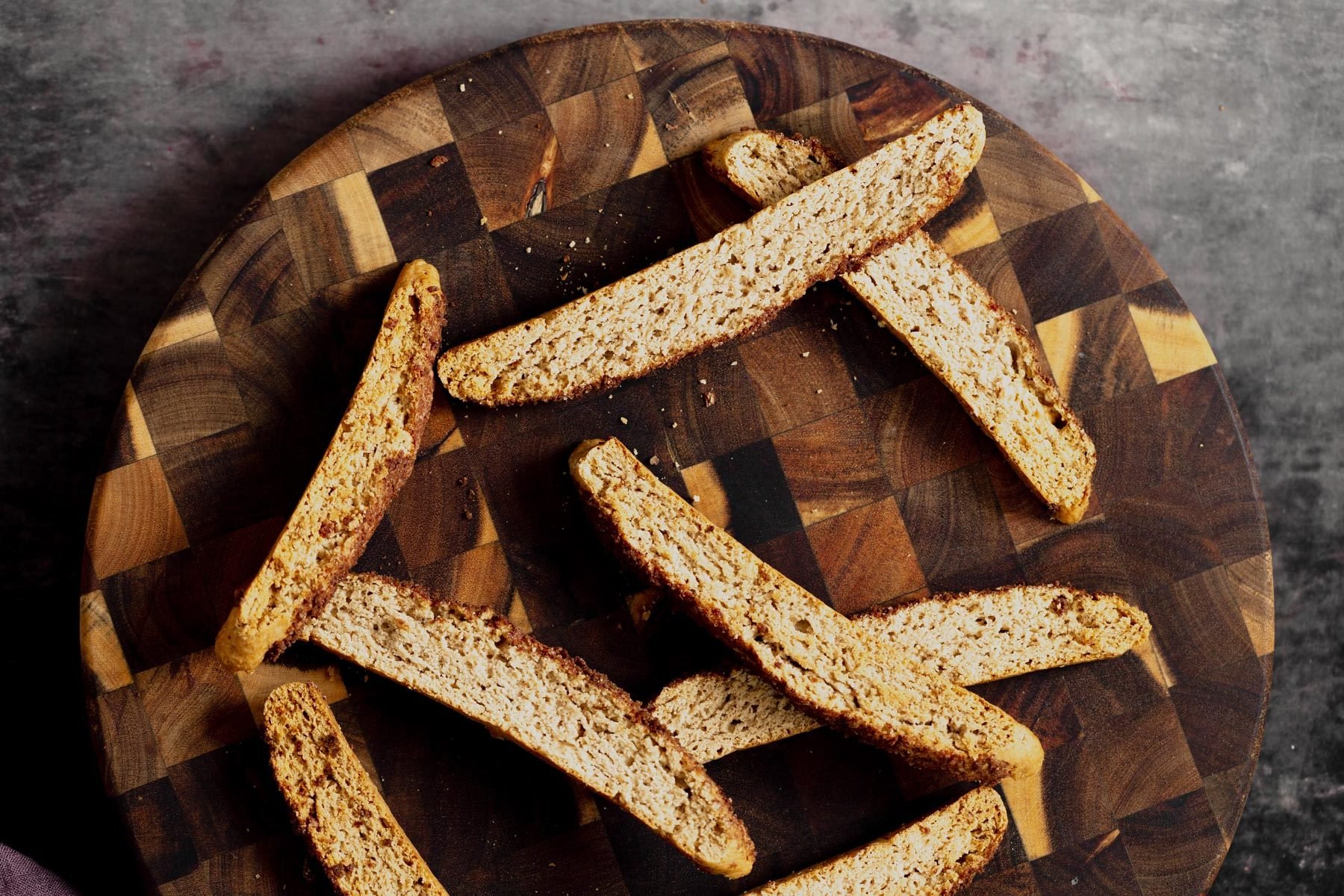 vegan biscotti vegan churro biscotti on a wooden plate