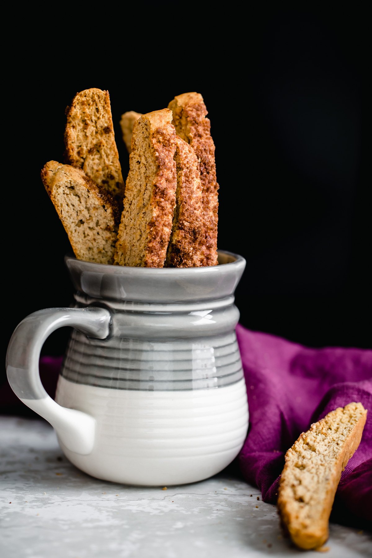vegan biscotti  homemade vegan cinnamon sugar biscotti in a small coffee mug