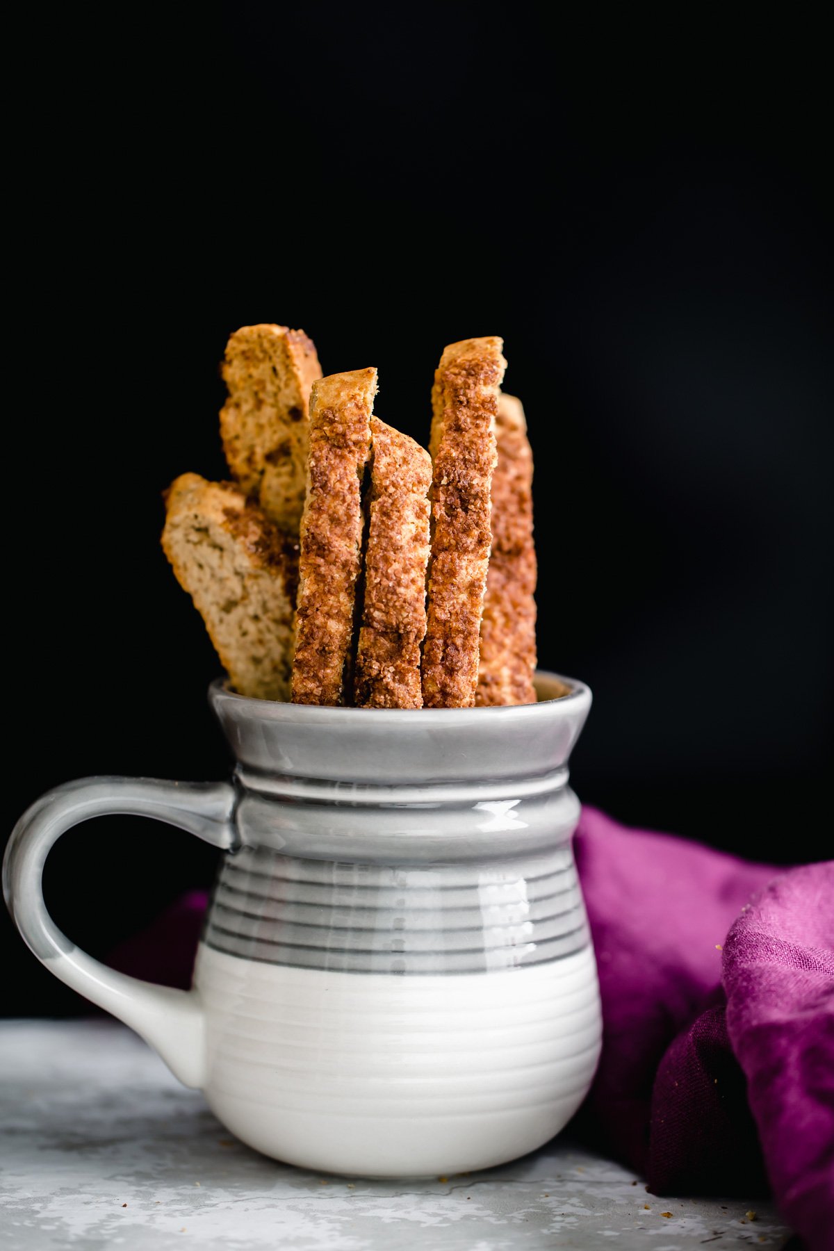 vegan biscotti  a coffee mug with vegan cinnamon sugar biscotti