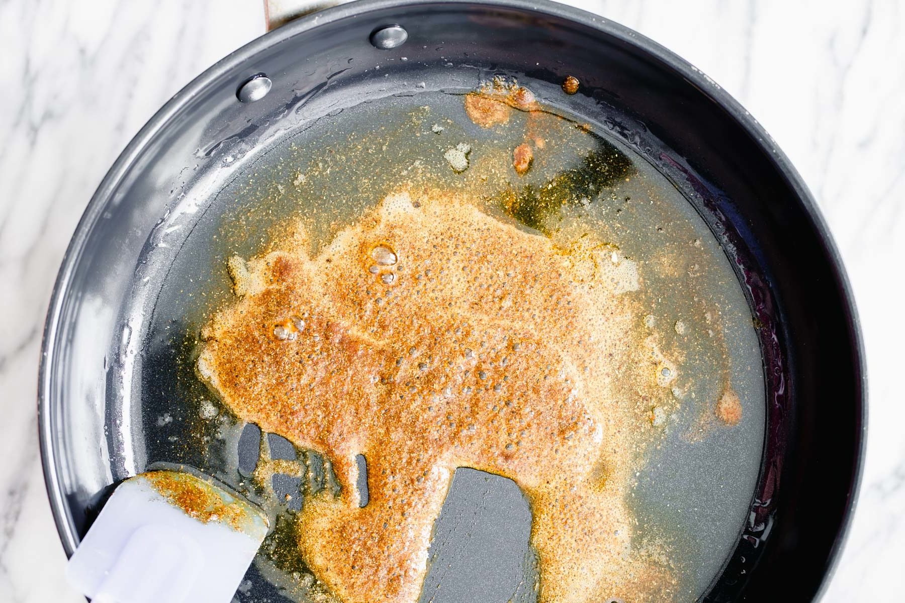 pumpkin curry  warming Indian spices being fried in oil to make pumpkin curry