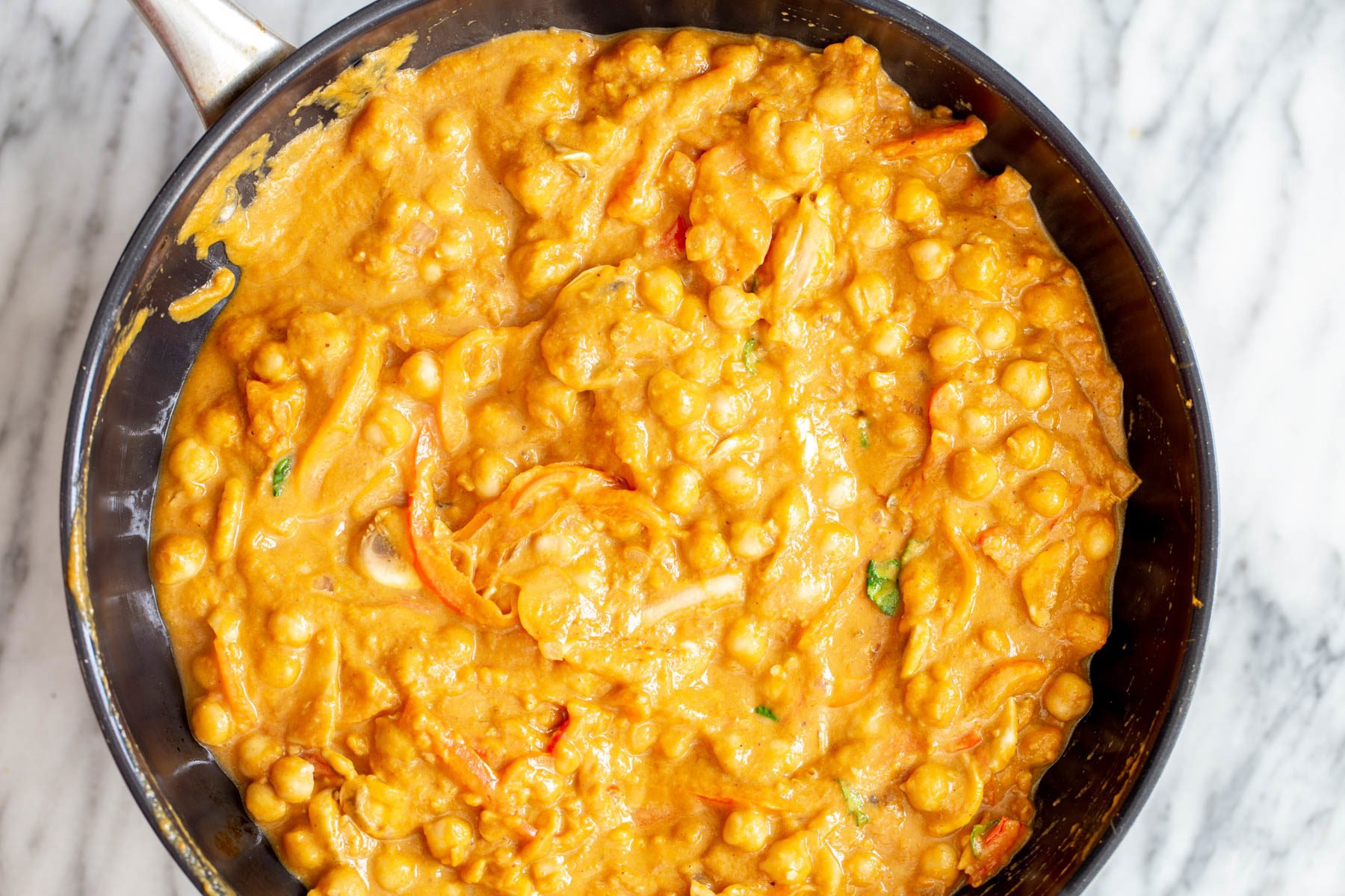 pumpkin curry  chickpeas being cooked in pumpkin gravy for making curry
