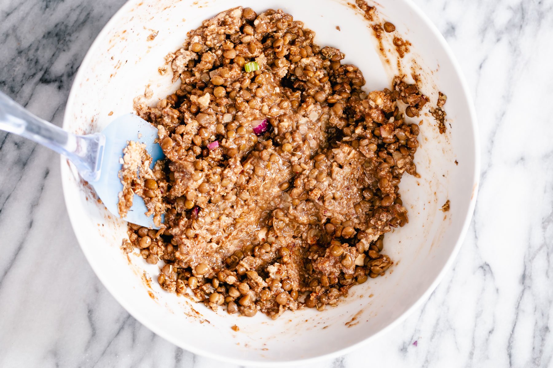 Thanksgiving sheet pan dinner lentil meatloaf mixture in a white bowl