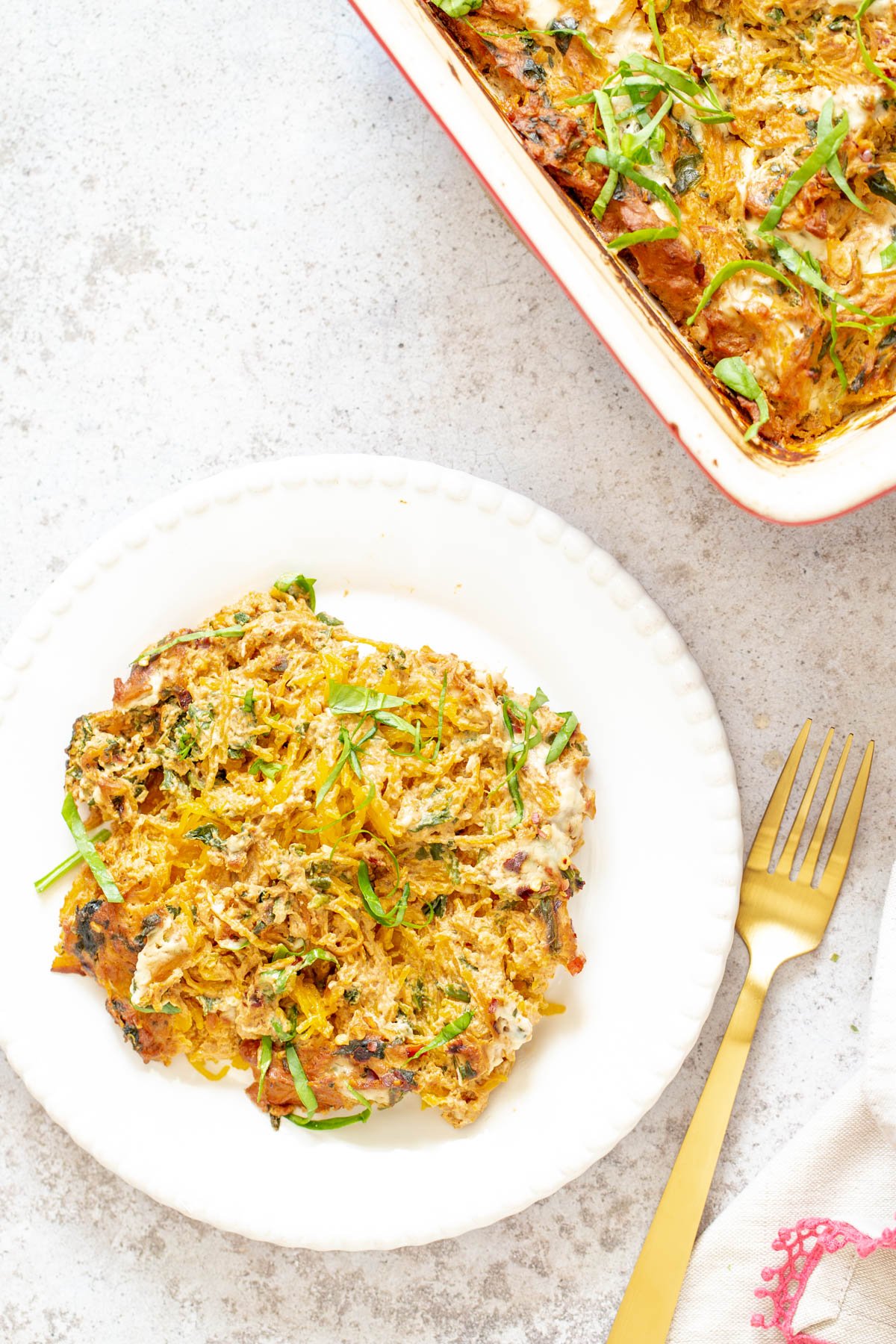 spaghetti squash bake  a plate with vegan spaghetti squash bake with creamy tomato sauce