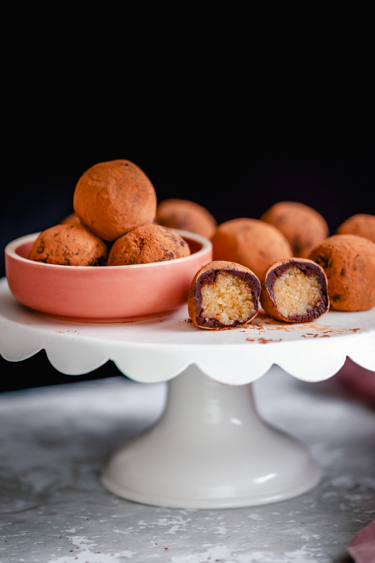 tiramisu truffles vegan tiramisu truffles on a cake stand with one truffle cut open