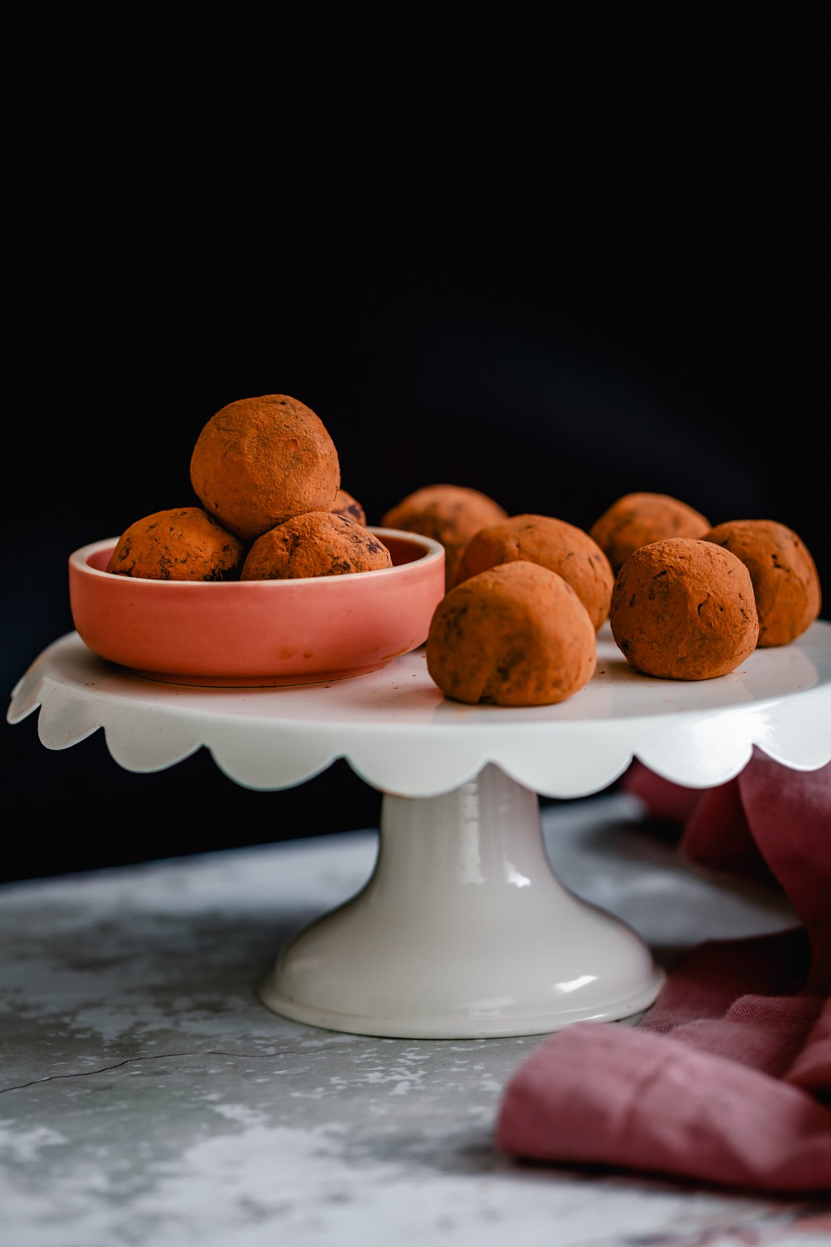 tiramisu truffles a cake stand with cocoa-dusted vegan Tiramisu truffles made with vegan cream cheese