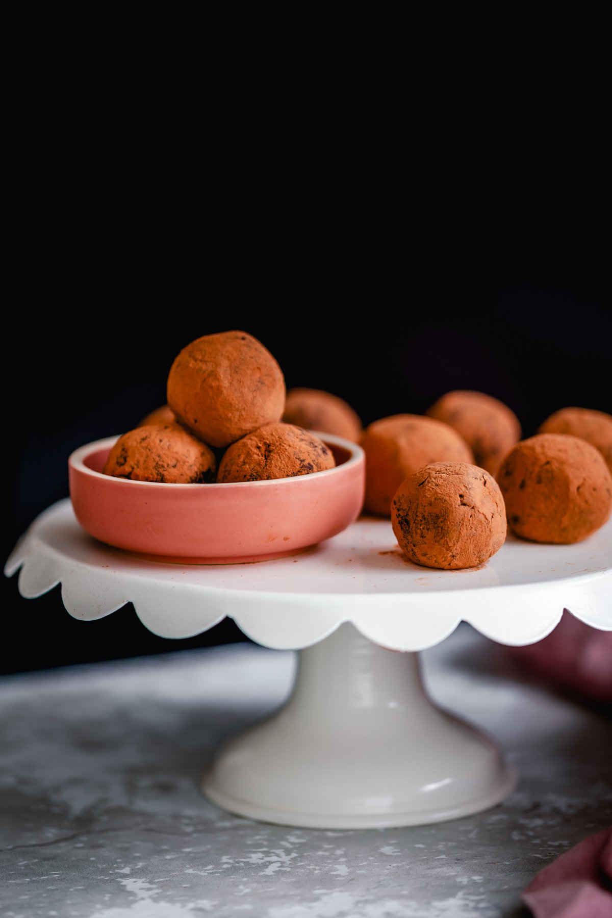 tiramisu truffles vegan tiramisu truffles rolled in cocoa powder presented on a cake stand