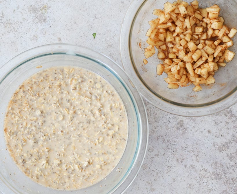a bowl with overnight oats with chia seeds next to a bowl with apple mixture
