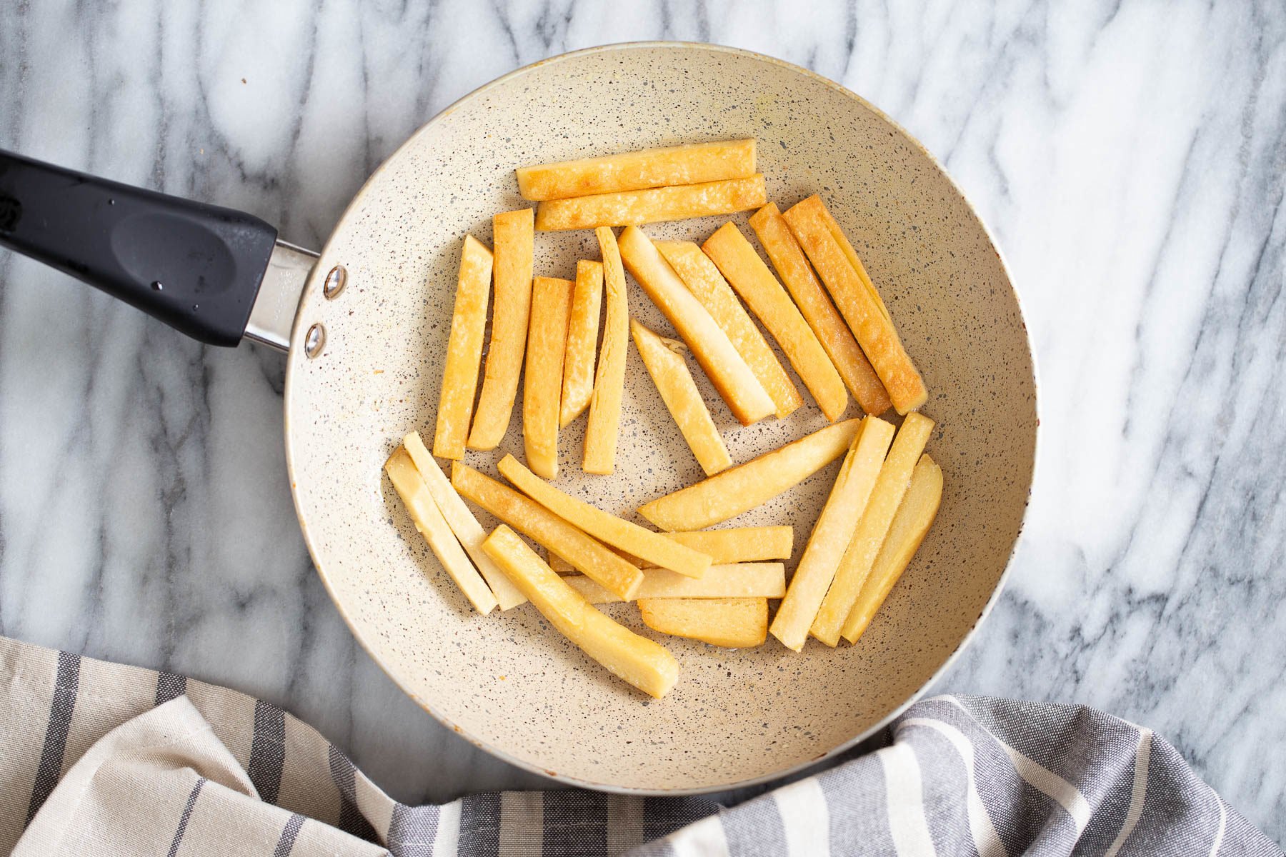 chickpea fries  chickpea flour fries being pan-fried in a skillet