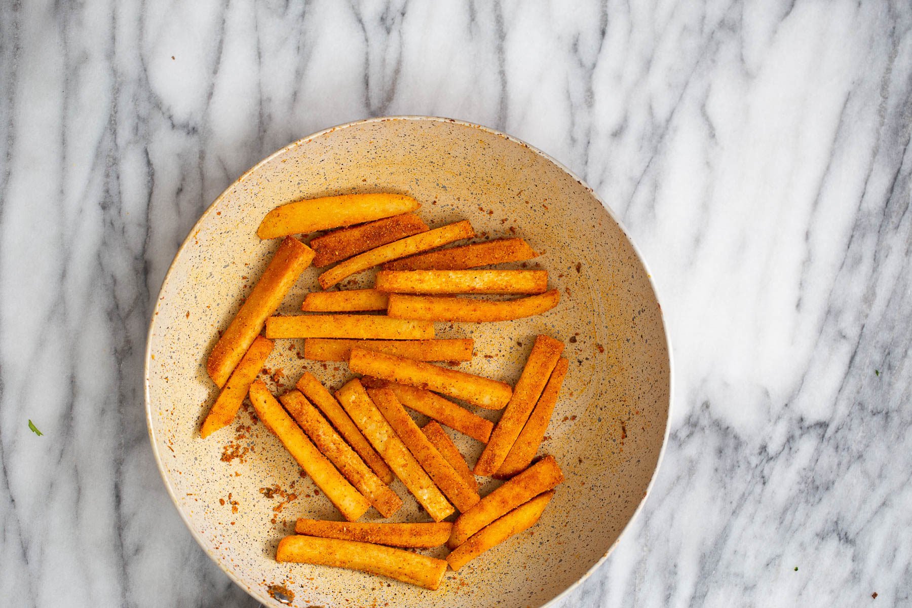chickpea fries  pan fried chickpea flour fries being tossed in salt and Cajun seasoning