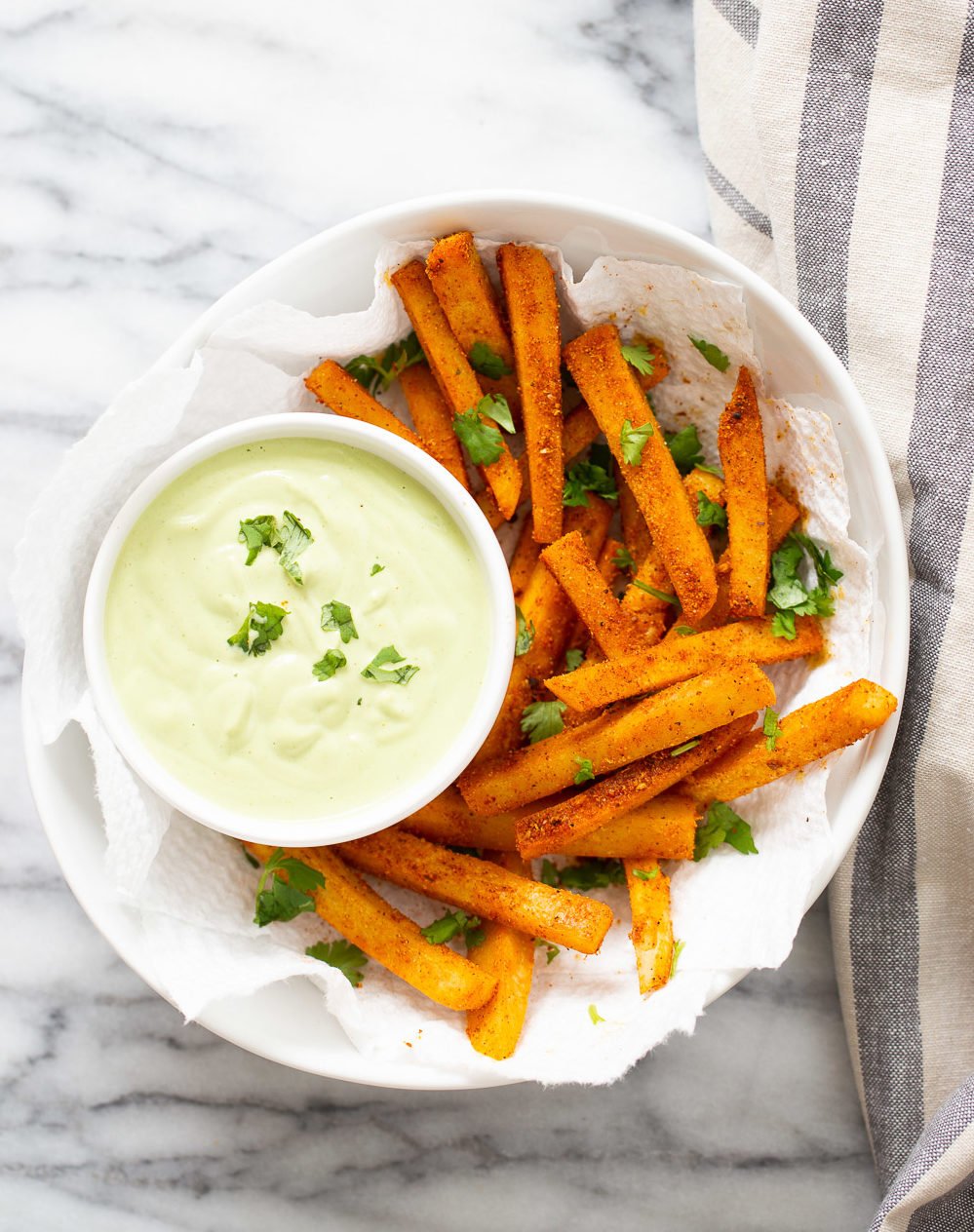 chickpea fries overhead shot of vegan pan fried chickpea fries tossed in Cajun seasoning and served with cilantro jalapeno lime dip