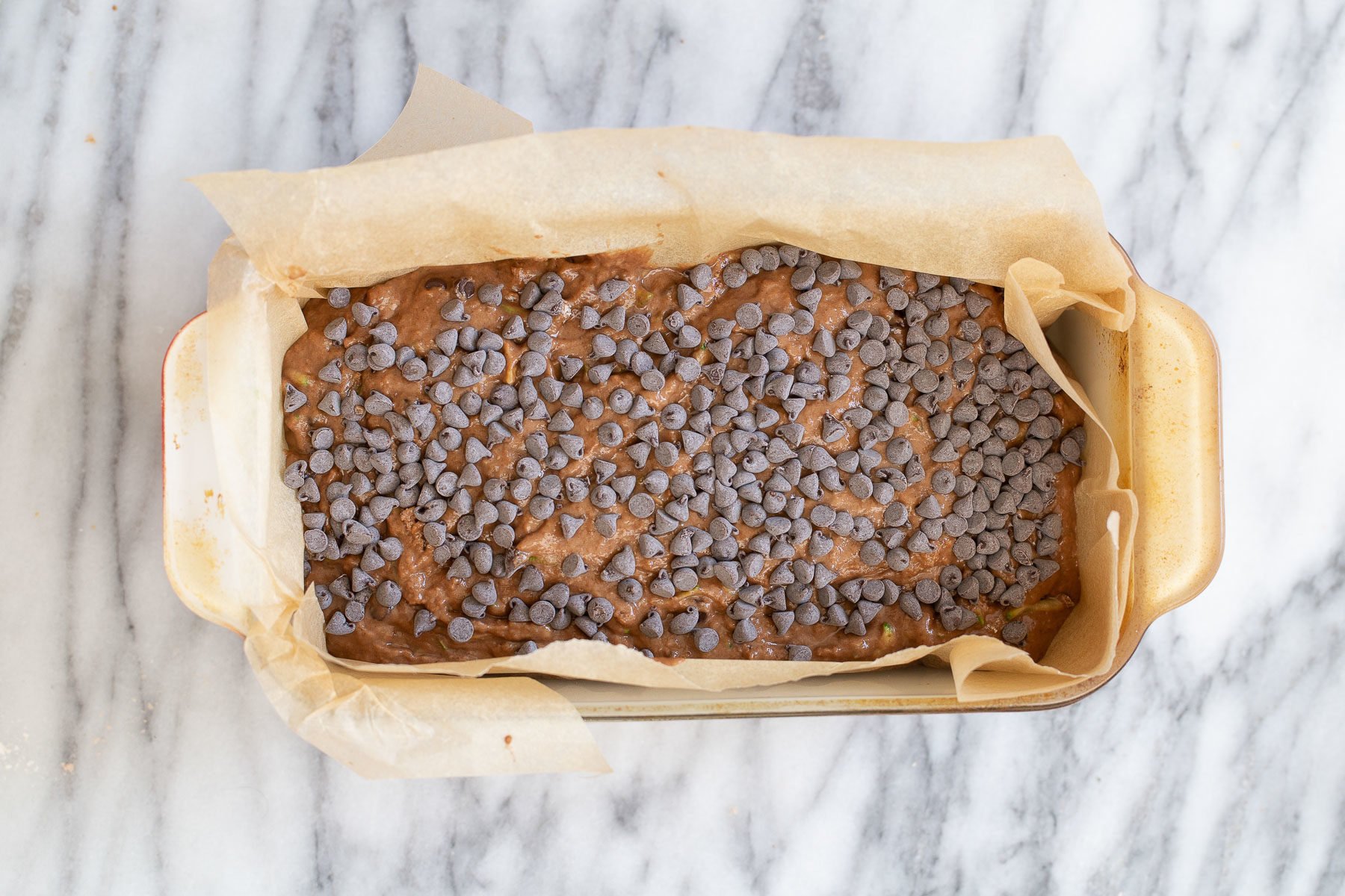 chocolate zucchini bread raw unbaked vegan chocolate zucchini bread sprinkled with chocolate chips