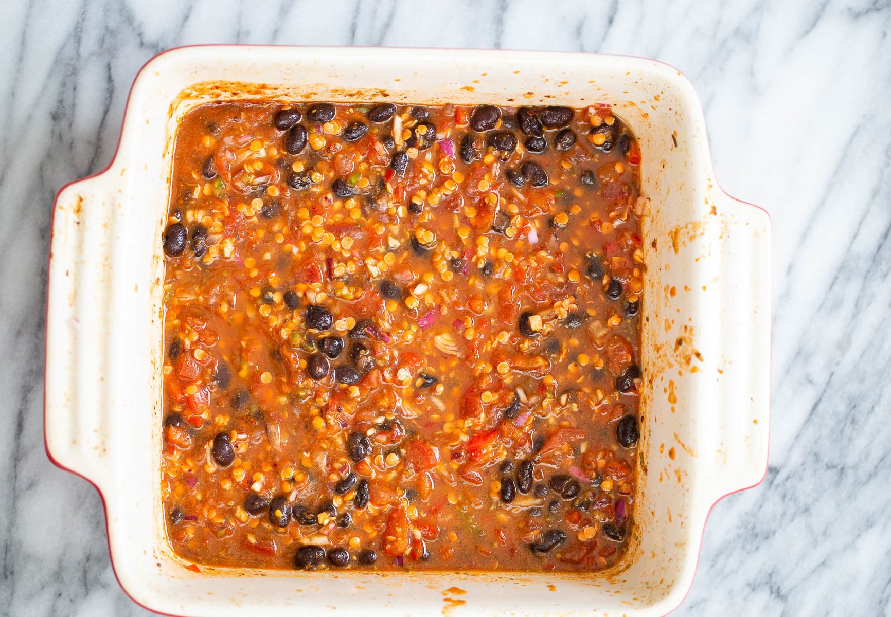 chili cornbread casserole chili mix in white casserole dish for cornbread casserole