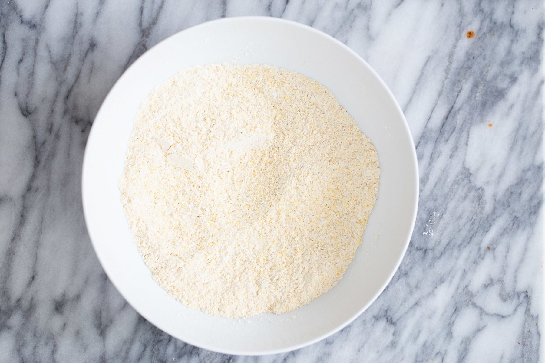 chili cornbread casserole dry cornbread mix in white bowl